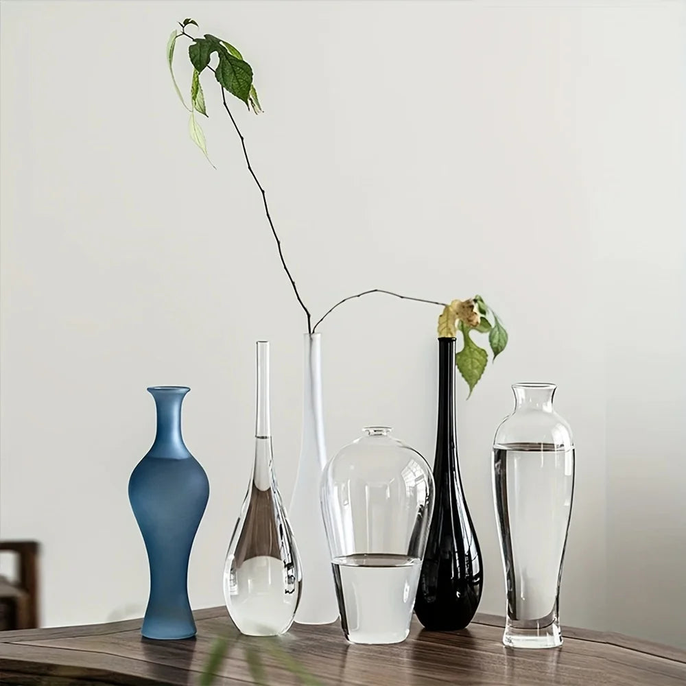 Style C glass bud vase showing tall cylindrical form on Japandi shelf display