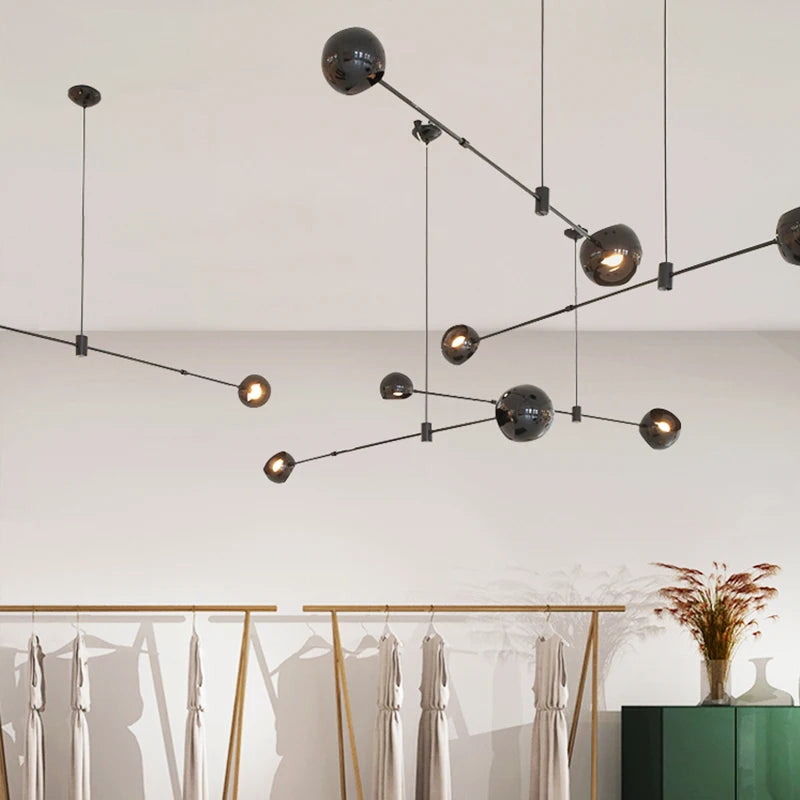 Six globe wrought iron chandelier throwing light upward and downward