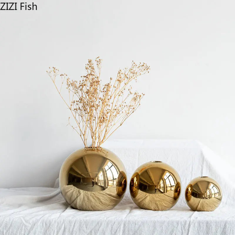 Gold ceramic ball vase small size on console table
