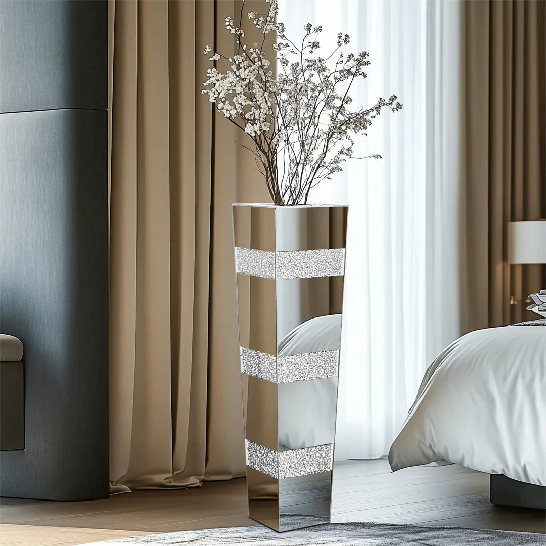 Small silver mirrored crystal floor vase as accent in contemporary hallway