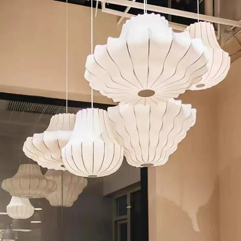 Hand knitted white silk shade wrapped over the chandelier metal frame