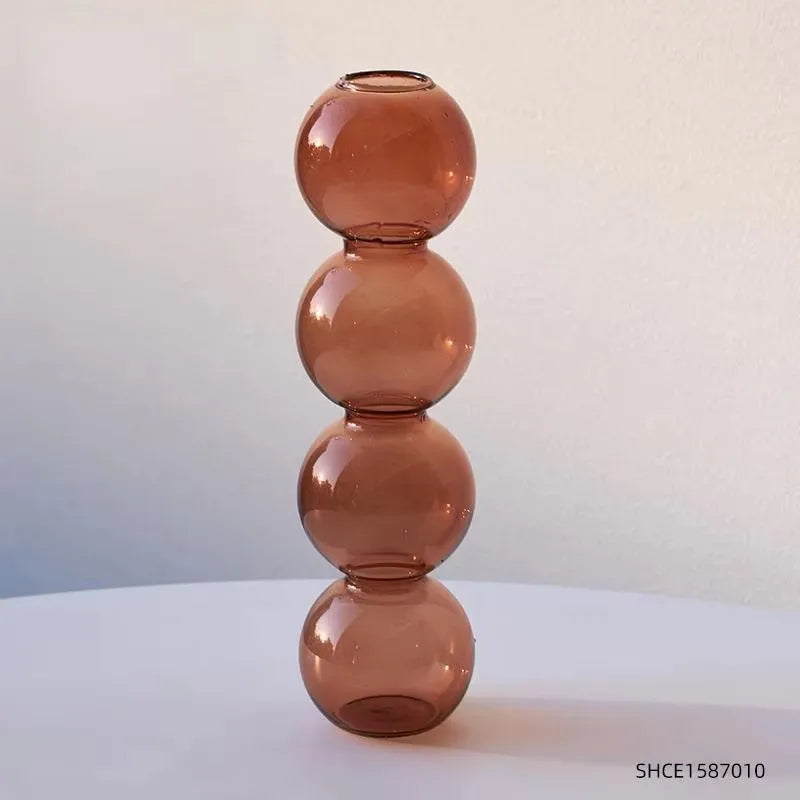 Champagne colored geometric terrarium vase as biophilic windowsill indoor display