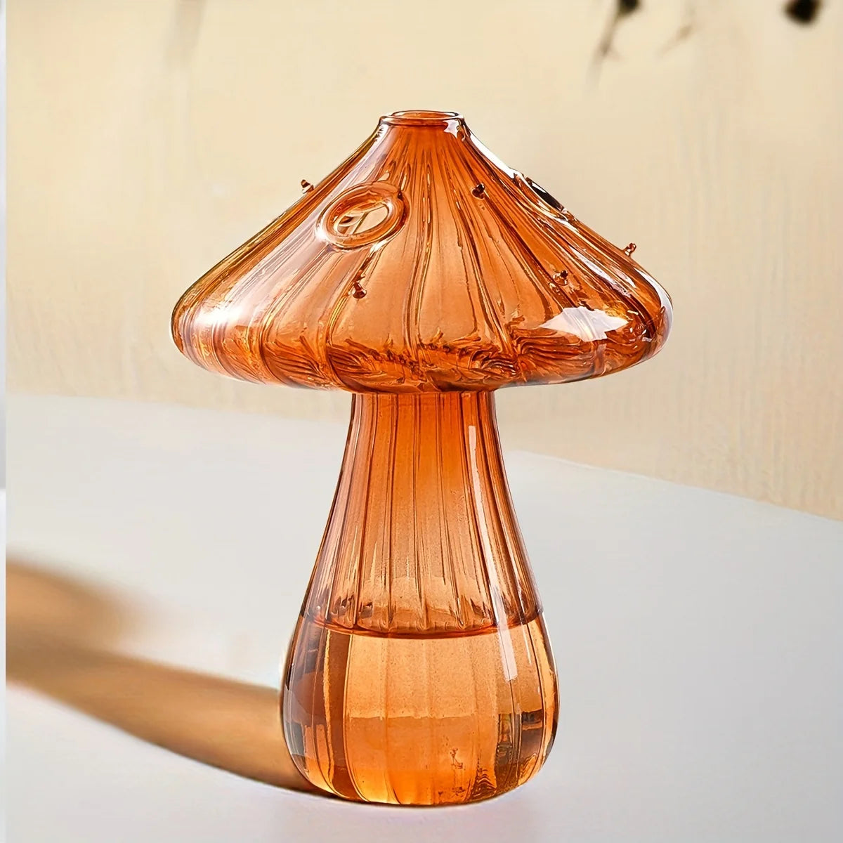 Yellow glass mushroom hydroponic planter with small decorative plant inside