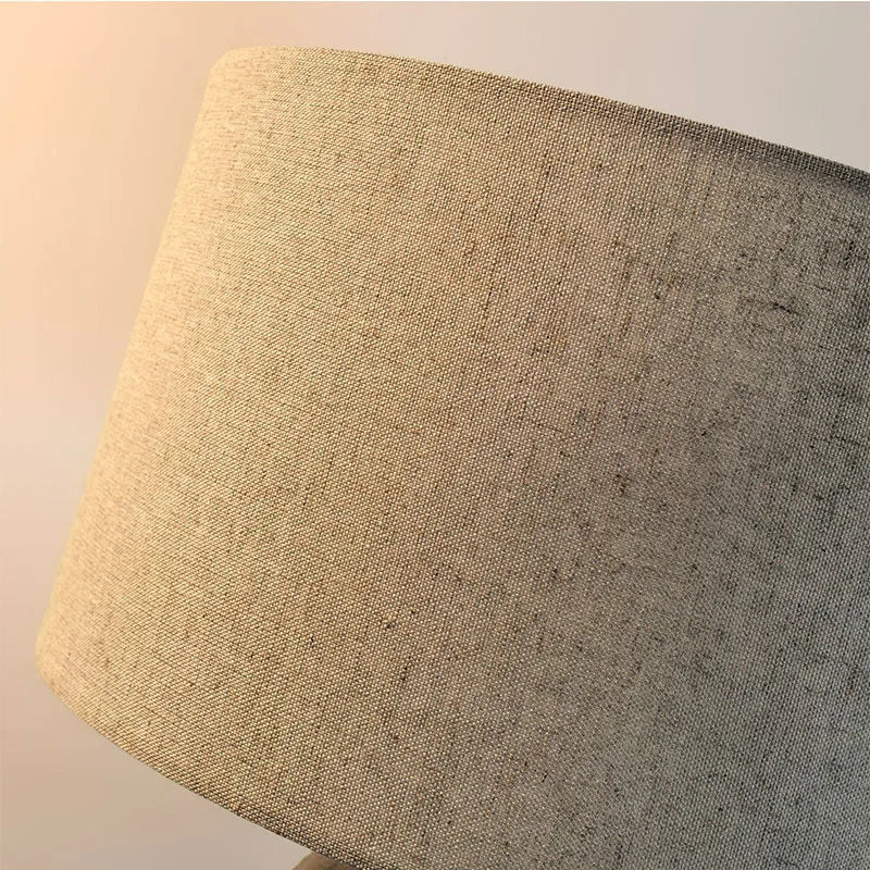Side view of Nordic marble cylindrical lamp in living room setting