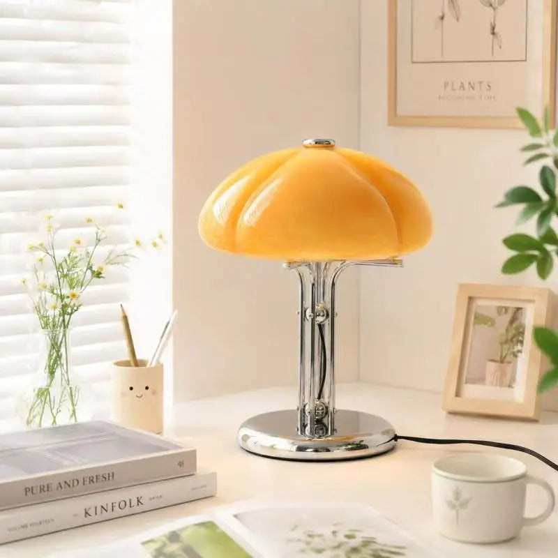 Chrome metal base detail of orange bauhaus mushroom table lamp