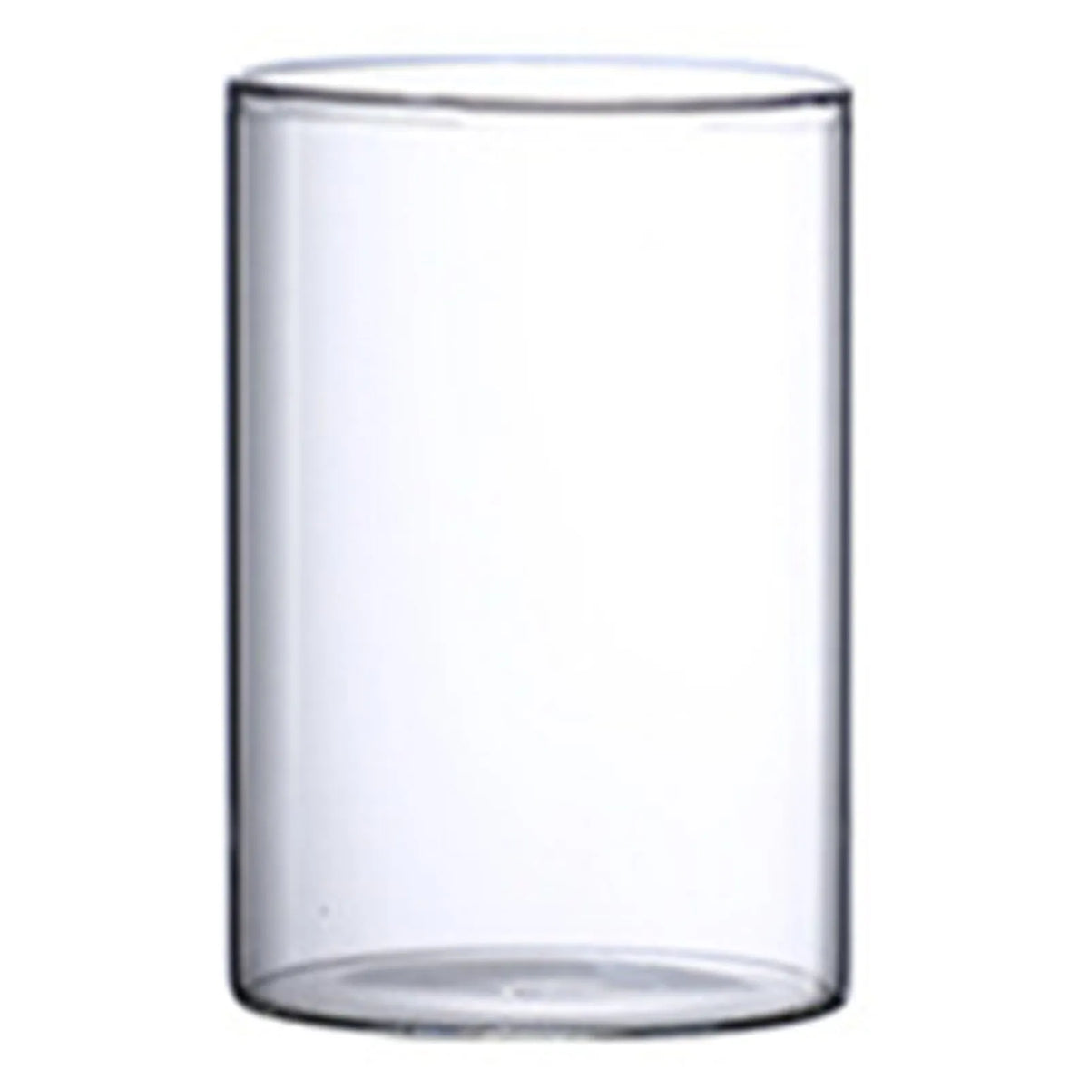 Two glass cylinder vases with floating tea light candles as elegant table centerpiece