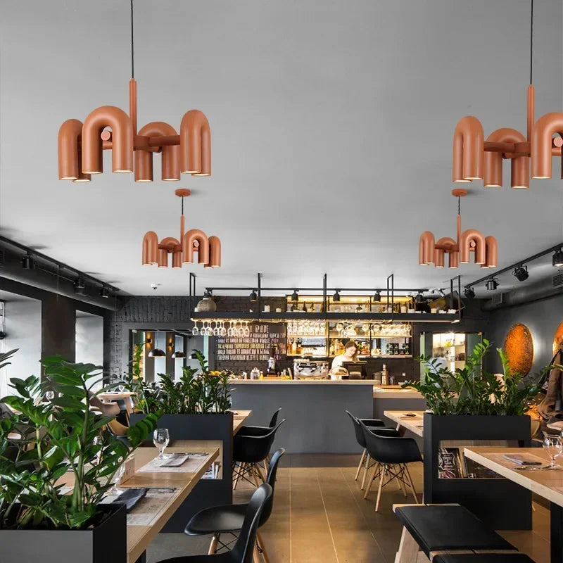 Orange iron chandelier with six U shaped arms, flush mounted