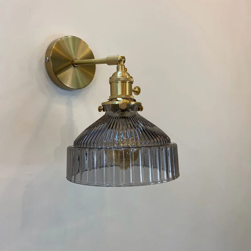 green glass bathroom wall sconce, detail view of fixture base and arm