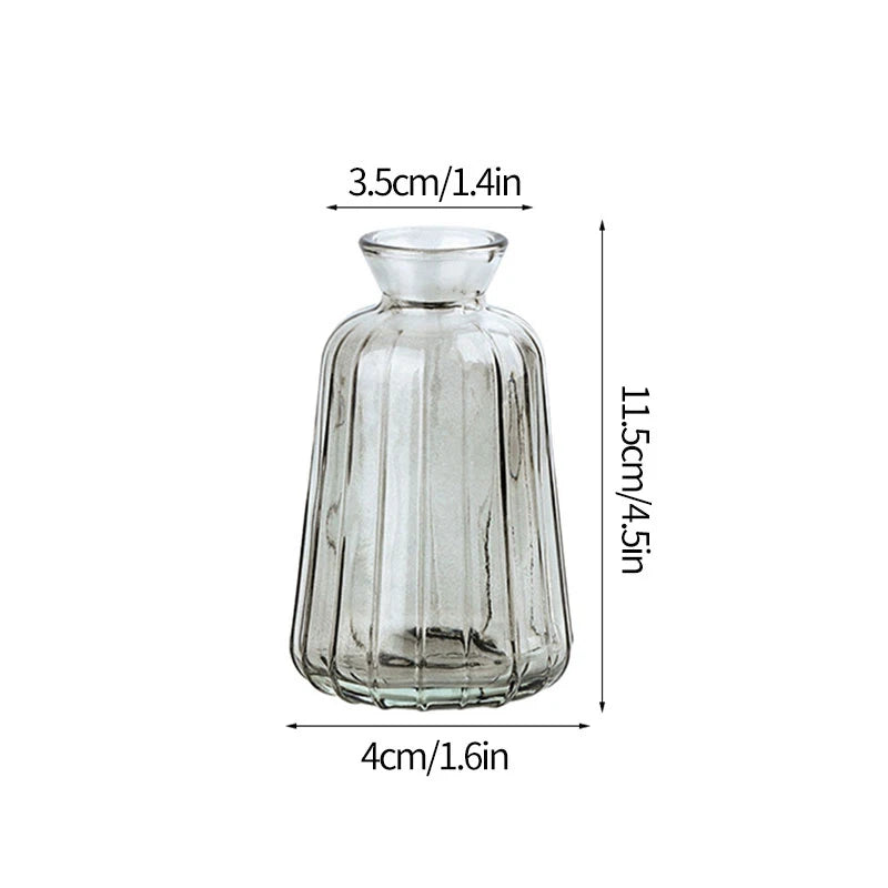 Clear glass floral vase styled on dining table for event