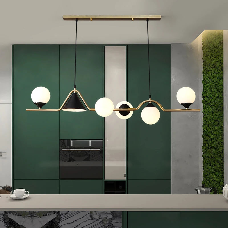 Transparent glass shade detail on a contemporary alloy chandelier bar