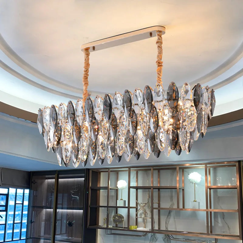 Oval crystal chandelier at 29.9 in length on a plated metal frame