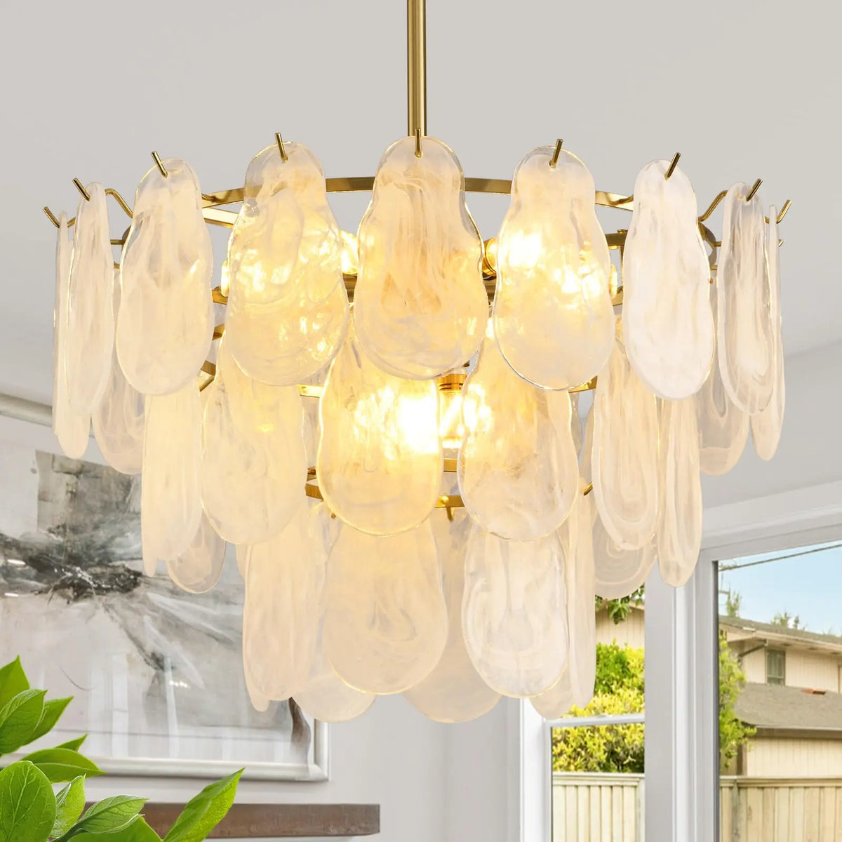 Tiered lantern glass chandelier with stacked shades on a gold frame