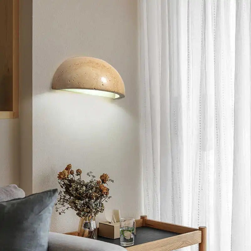 stone wall sconce, detail view of fixture base and arm