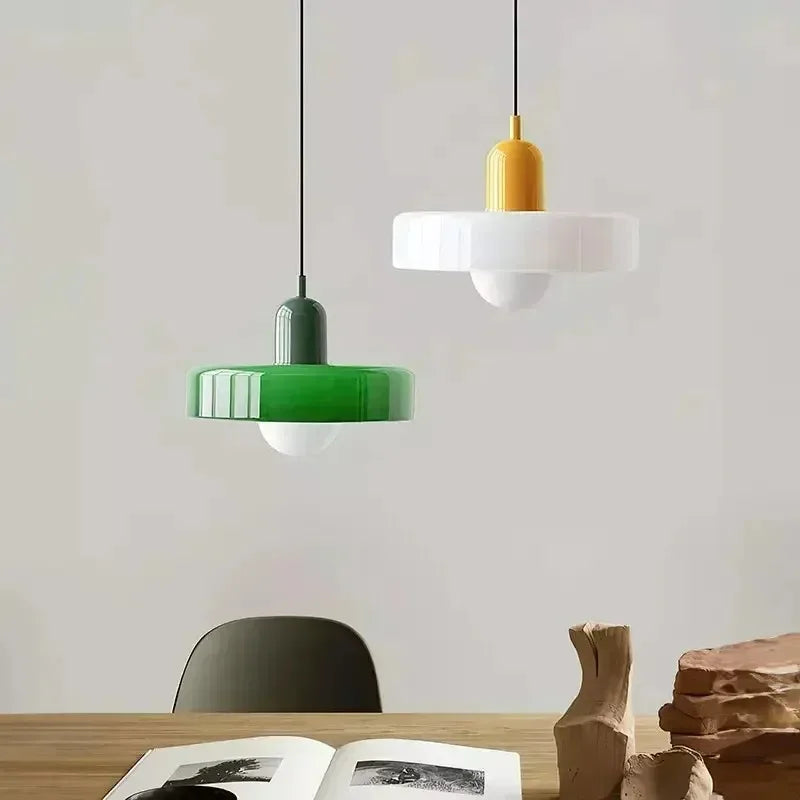 Green glass chandelier shade measuring 25 by 20 centimetres
