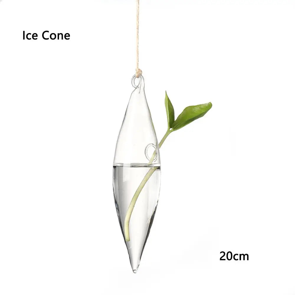 Glass hanging vase with plant cuttings in a bright airy Scandi home interior