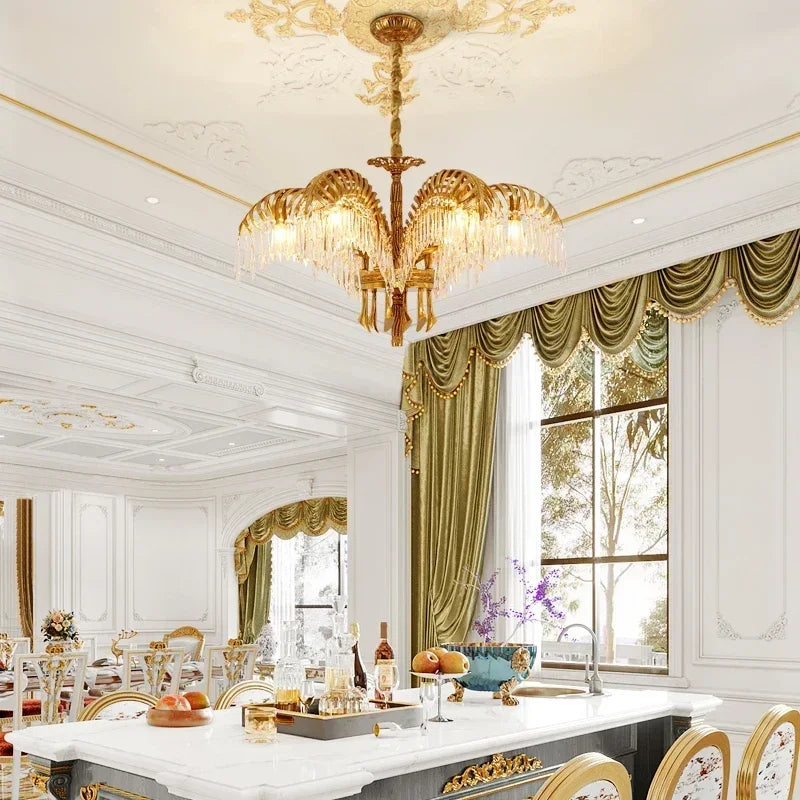 Palm leaf crystal chandelier hung on a chain from the ceiling