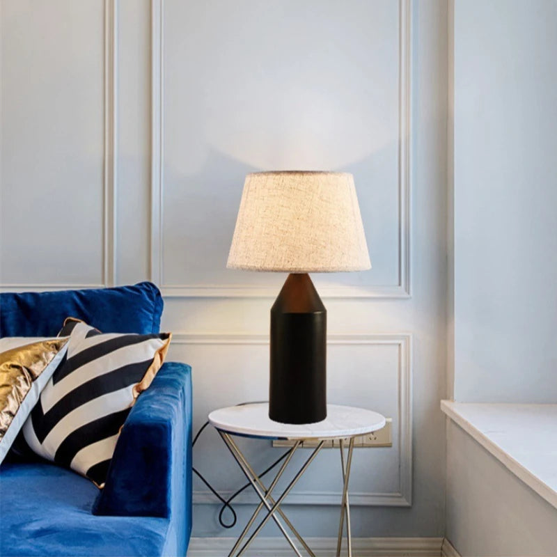 Minimalist metal table lamp on marble surface in natural light