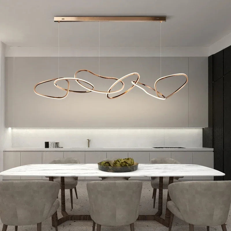 Gold finish circle chandelier in brushed stainless steel, flush mounted