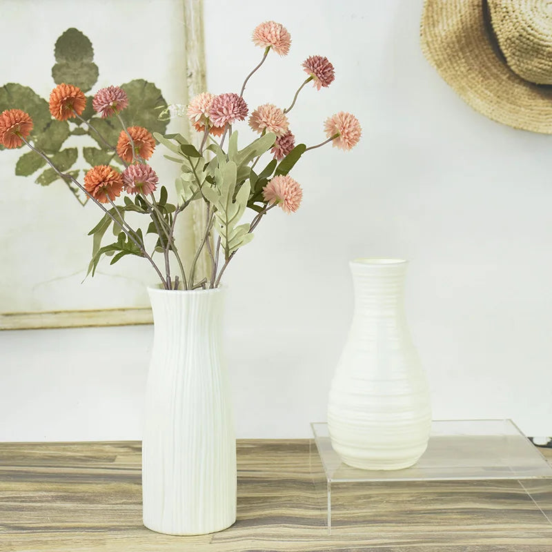Three Nordic white plastic pots in styles Z01 Z03 and Z04 displayed together on shelf