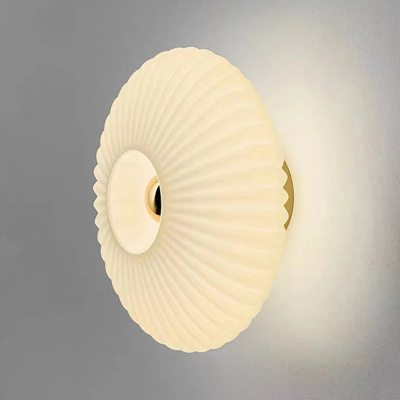 glass wall sconce, installed in a room interior setting