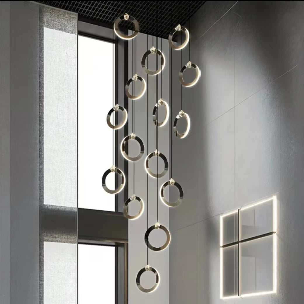 Black and gold ring staircase chandelier with acrylic light diffusers