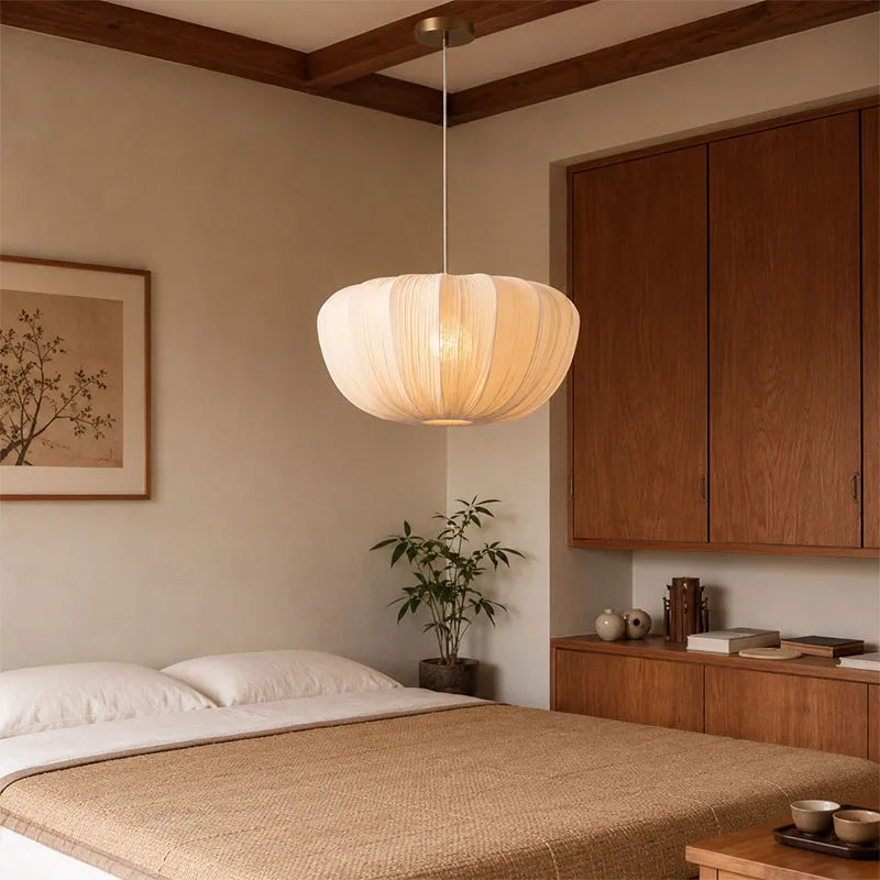 Wabi sabi fabric chandelier with a rounded textile shade on an iron frame