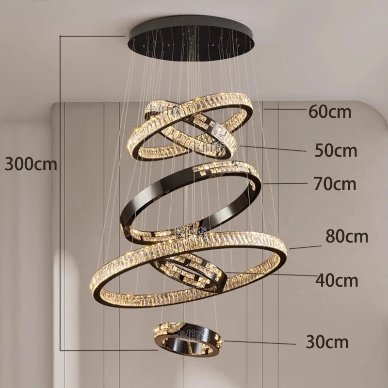 Tapering crystal ring chandelier for a double height stairwell