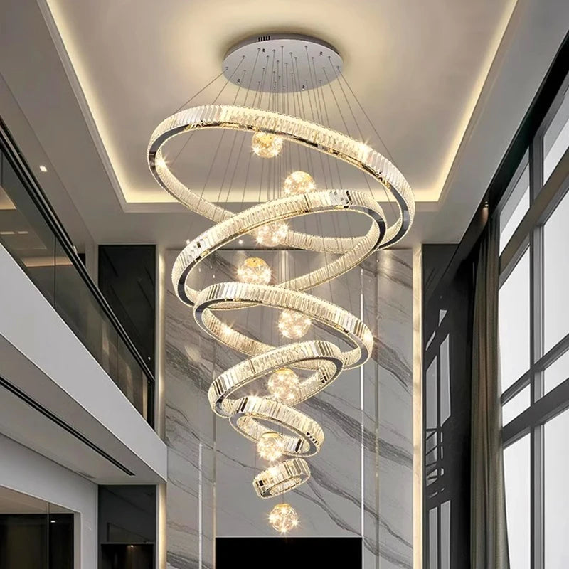 Gilded ring crystal chandelier with crystal wrapped rings hung on cords