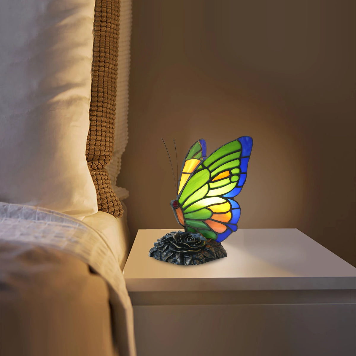 Handmade green butterfly stained glass table lamp warm glow front view