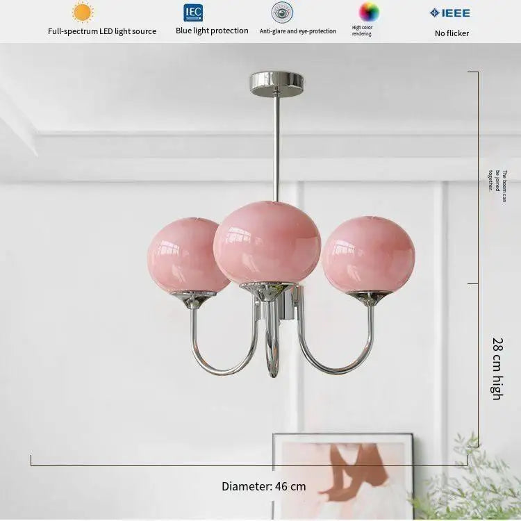 Frosted glass wall lamp in pink with a chrome finished mounting plate