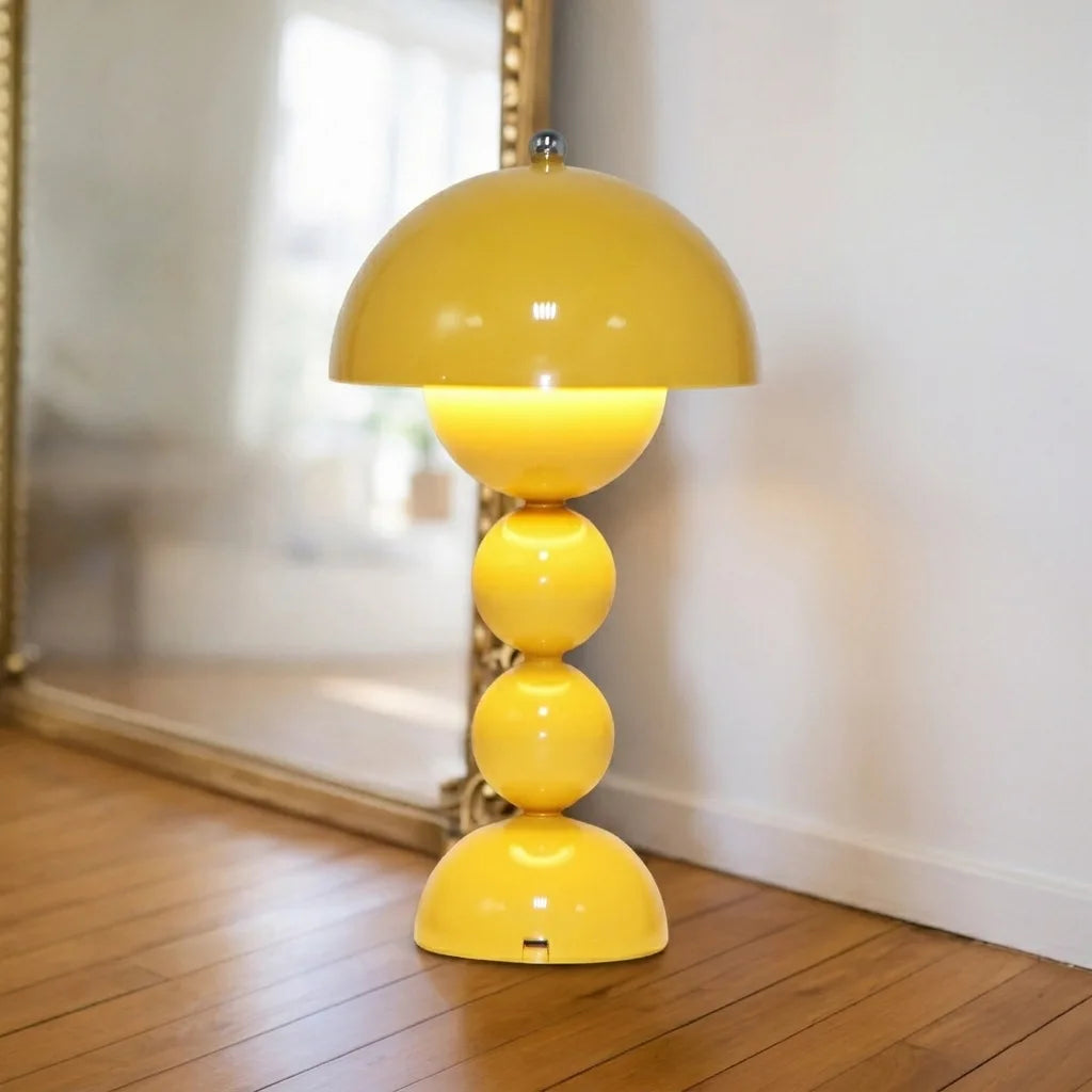 Black flower bud desk lamp fully illuminated on office study desk