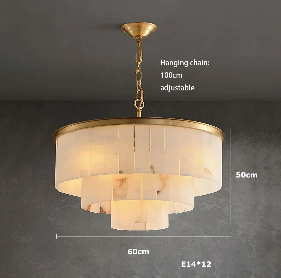 Natural marble chandelier lit in white light on polished steel