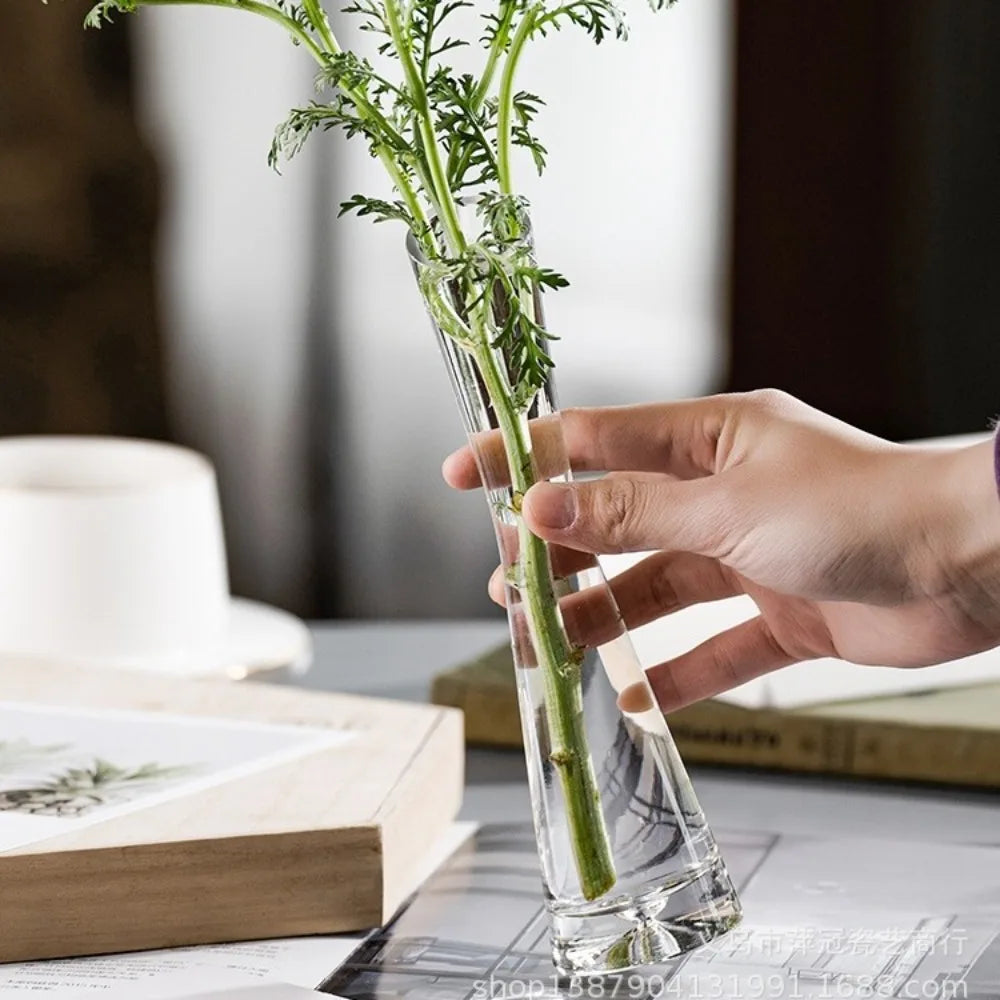 Slanted mouth glass vase with dried botanicals in contemporary home interior