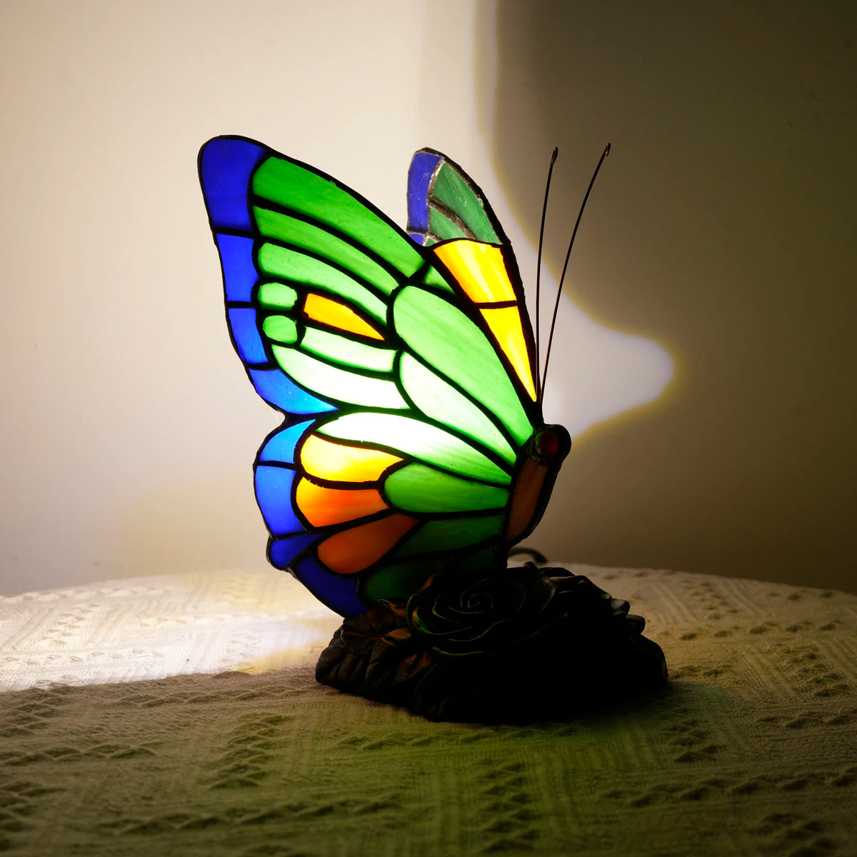 Green stained glass butterfly lamp UK plug variant side profile view