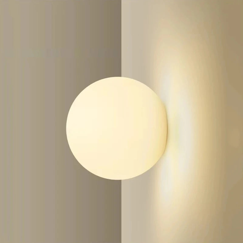 glass bathroom wall sconce, front view on white background