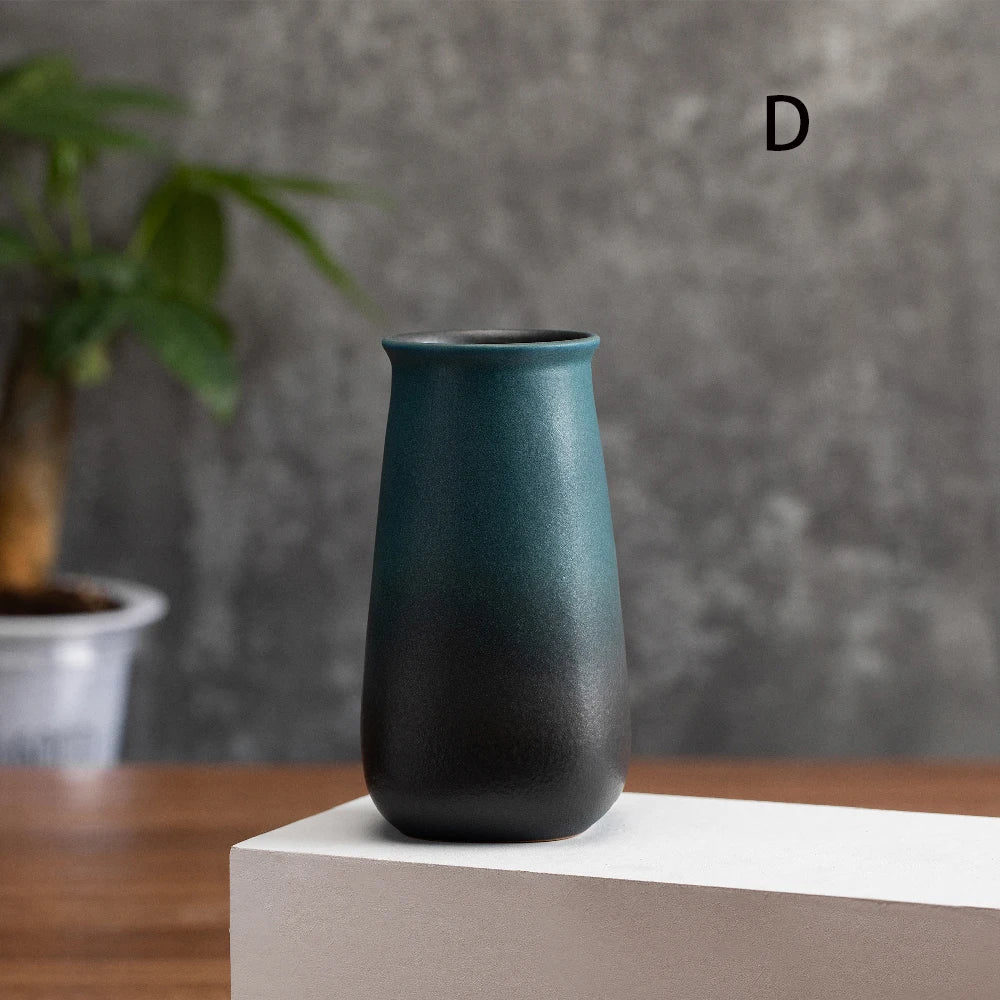 Group of four frosted matte ceramic small bud vases in all style variants together