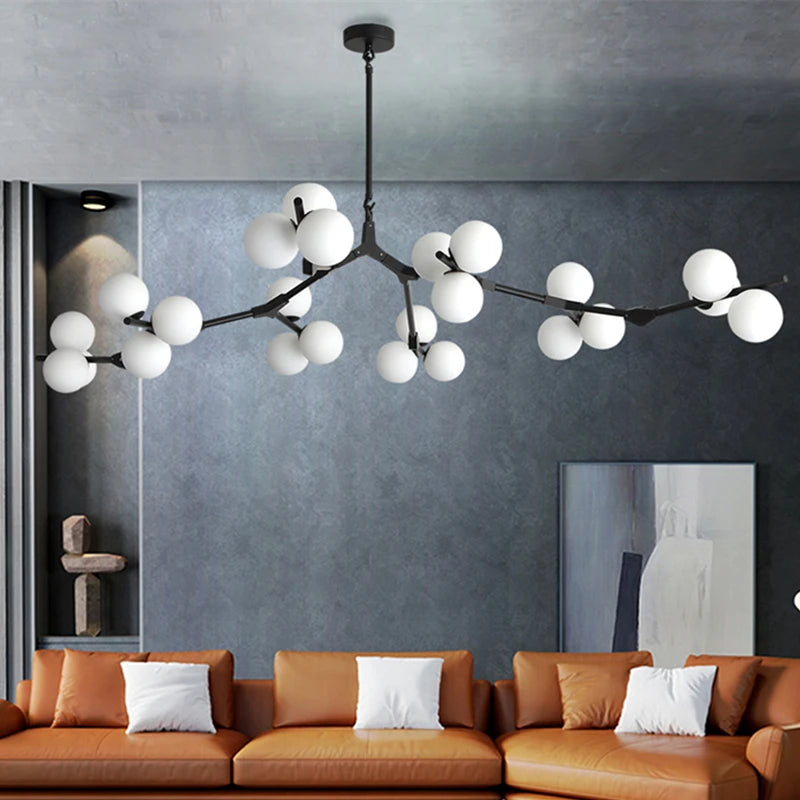 Black gold glass branch chandelier with frosted shades on iron arms