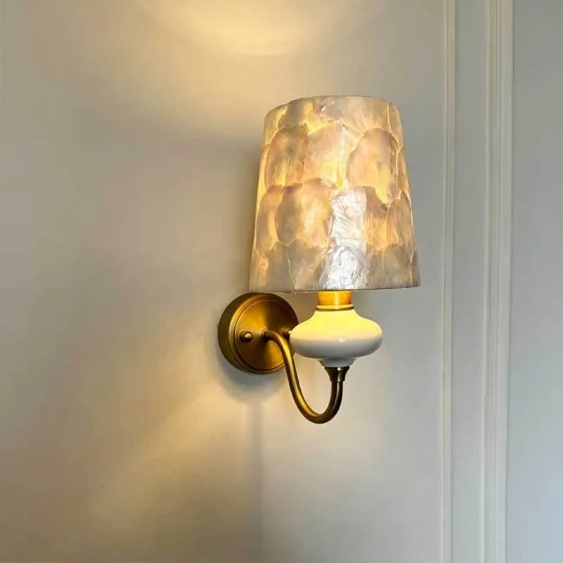 ceramic wall sconce, installed in a room interior setting