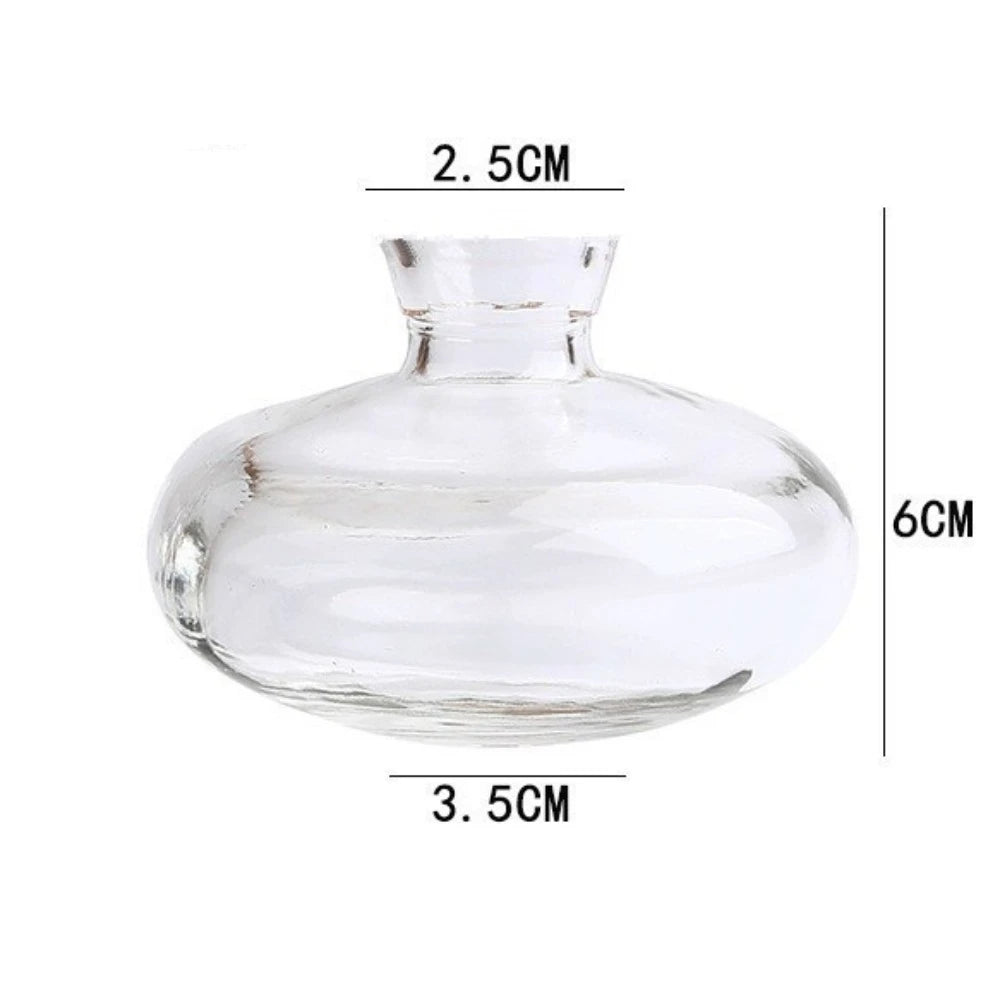 Mini glass vase with single flower stem on dining table display