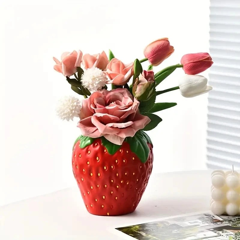 Close-up of strawberry ceramic vase surface texture and seed dot detail