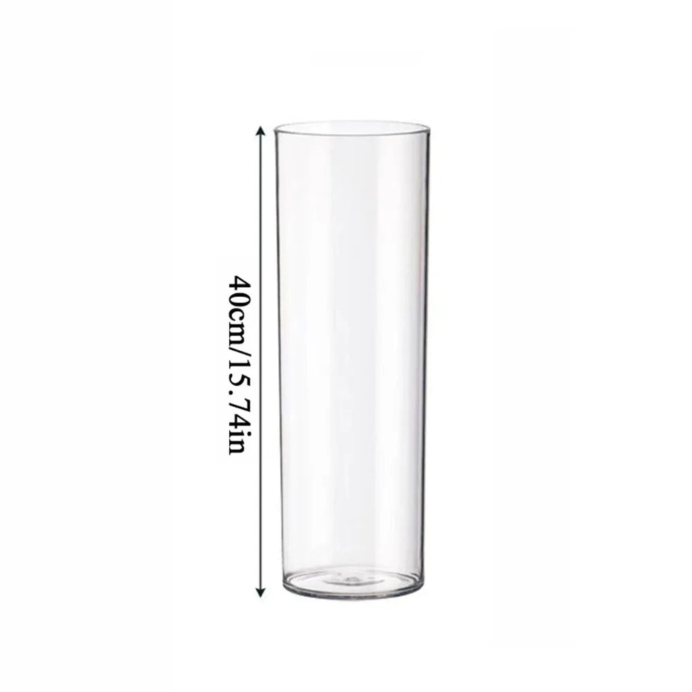 Three sizes of clear acrylic vase arranged together as floor display