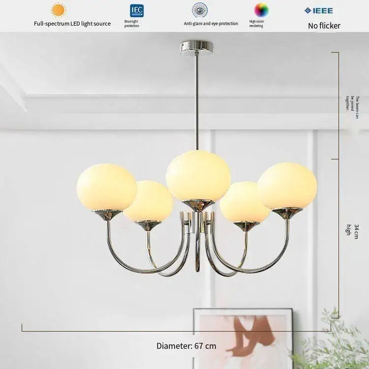 Five head frosted glass chandelier in yellow with a gold toned frame