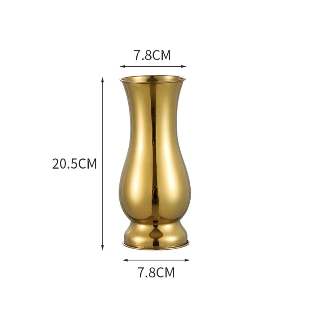 Side view of slender gold steel single stem vase showing tapered form