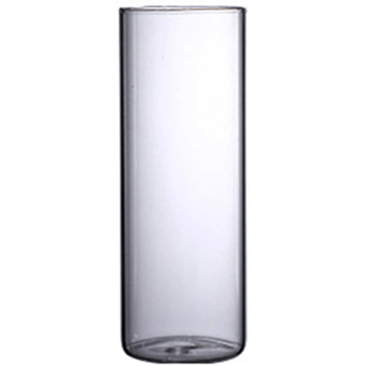 Glass cylinder vase flat lay on grey concrete surface with fresh eucalyptus sprig