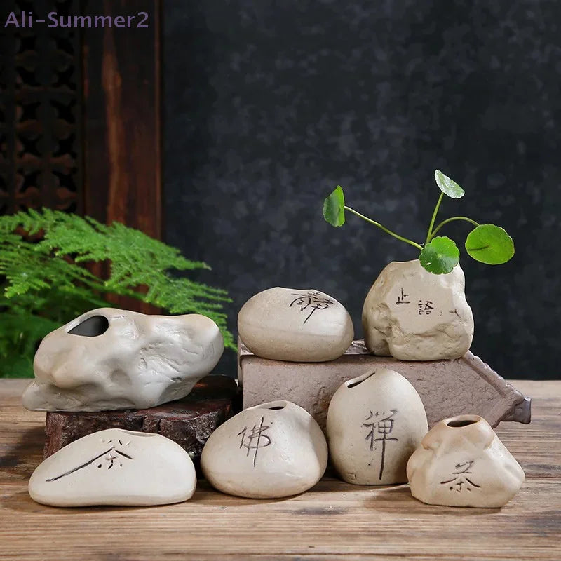 Mini stone-effect ceramic Zen vase in dark grey displayed on natural wooden shelf