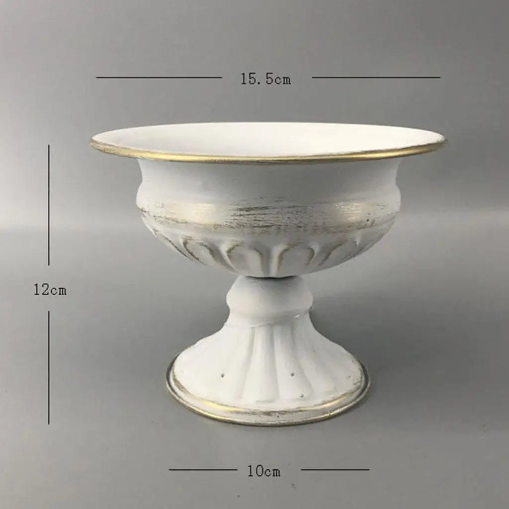Close-up of gold metal vase showing polished metallic surface finish detail