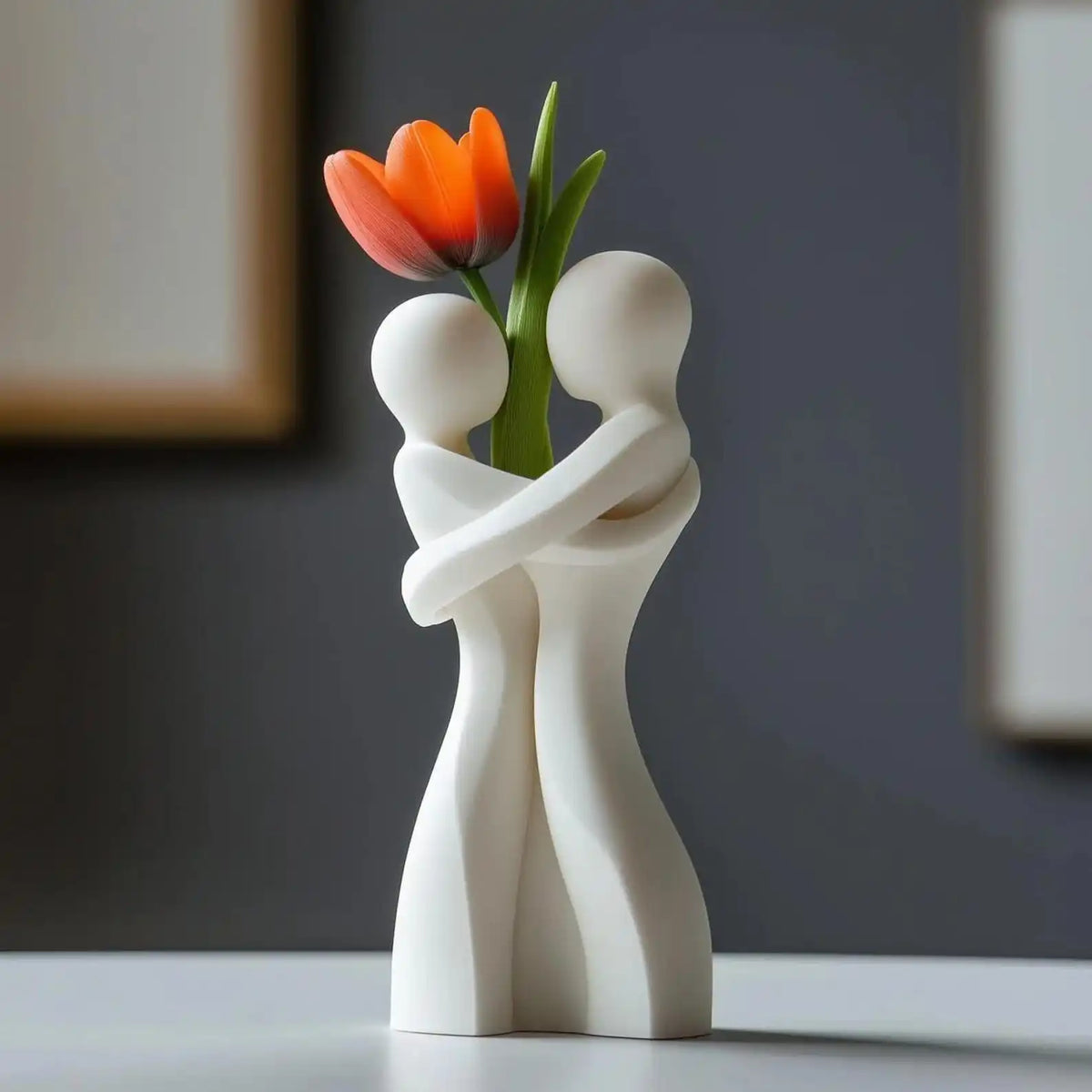 Ceramic hugging figures vase in white angled view showing full heart silhouette form