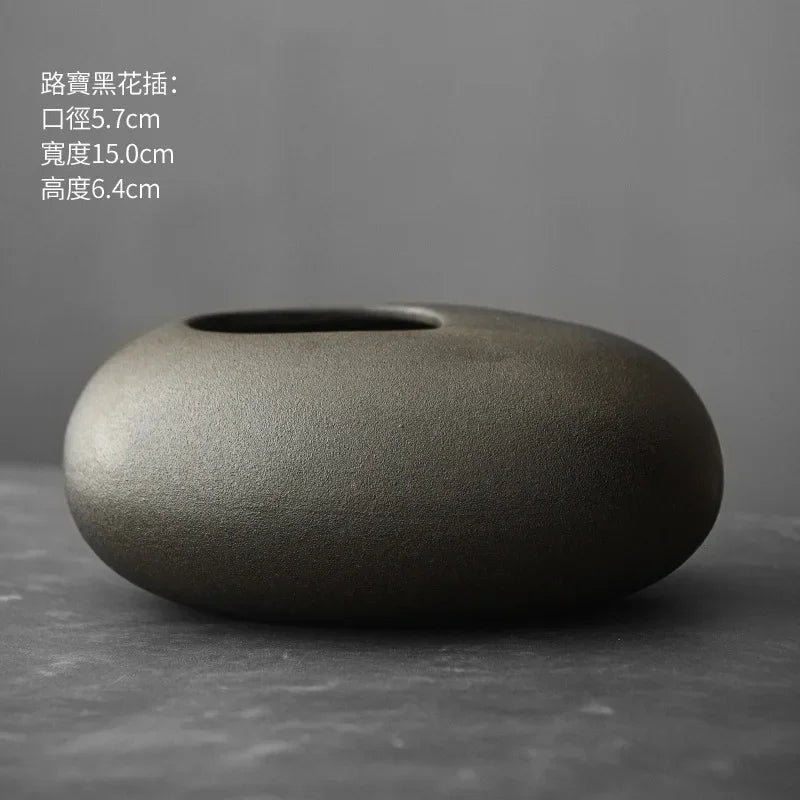 Style K terracotta vase with bulbous base and elongated neck detail