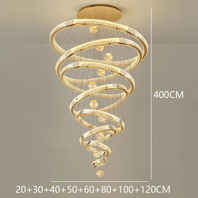 Neutral light setting on a modern crystal ring stair chandelier