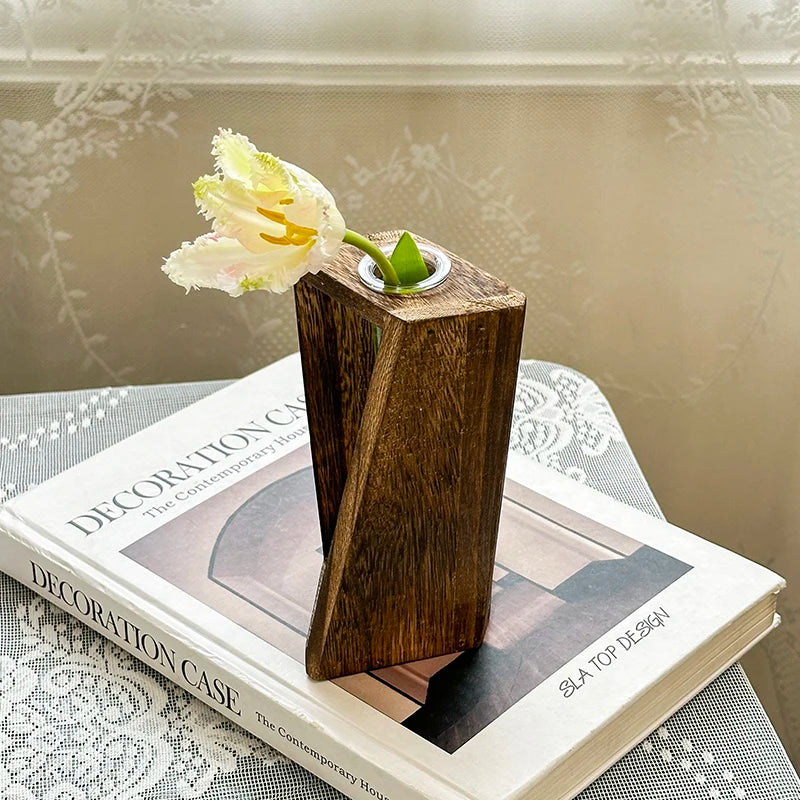 Wooden retro hydroponic vase with pothos cutting in water on home desk